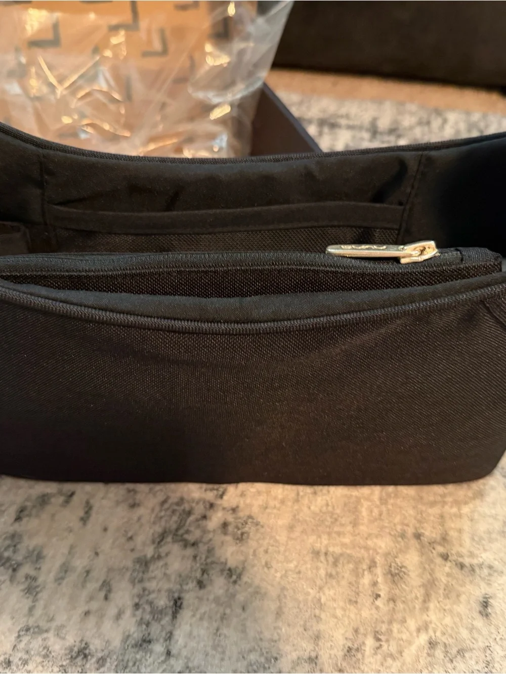 Black NUNA stroller organizer